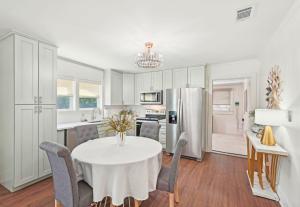 a kitchen and dining room with a table and chairs at Marietta Charmer in Marietta