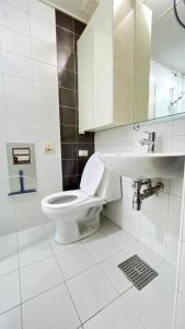 a bathroom with a toilet and a sink at Kozy House in Gangnam in Seoul +24 photos