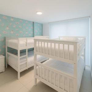 Ένα ή περισσότερα κρεβάτια σε δωμάτιο στο Orilla Azul - Apto Playa