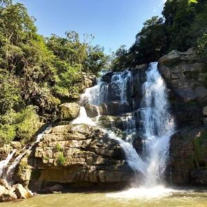 a waterfall on the side of a rocky mountain at Guaduas apartaestudio Angel de la Villa in Guaduas