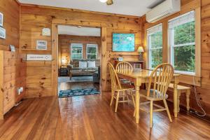 a dining room with a table and chairs at Maine Coastal Cottage in Wells
