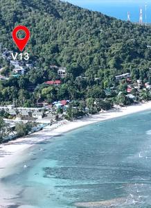 a red object in the air over a beach at Haad Yao Villa 13 Luxury Sea View & Pool in Koh Phangan +40 photos