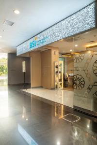 a lobby of a building with a sign that reads exit at Skysuites Residence Surabaya in Kedungbaruk