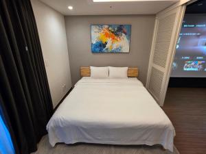 Postel nebo postele na pokoji v ubytování Felix by STX Hotel & Suite