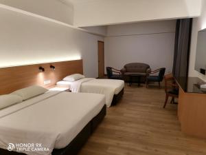 巴生港海景水晶皇冠酒店客房内的一张或多张床位