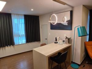 TV a/nebo společenská místnost v ubytování Felix by STX Hotel & Suite