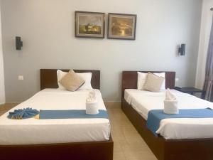 Best Central Point Hotel客房内的一张或多张床位