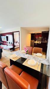 a dining room with a table and chairs at Ming Garden The Nala Suite Kota Kinabalu in Kota Kinabalu