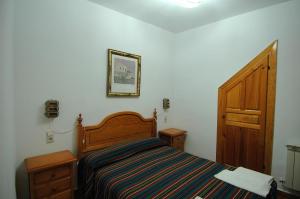 Postel nebo postele na pokoji v ubytování Apartamentos Turísticos Rural Los Tinaos