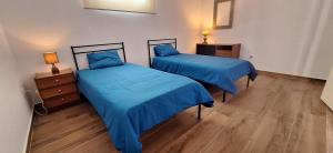 En eller flere senge i et værelse på Casa Cor do Vinho + 29 billeder