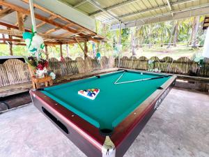 a pool table in the middle of a garage at Taylors Plantacion Resort- Grande Superior Room in Catarman