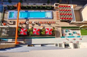 an aerial view of a building with a swimming pool at City View Downtown Dallas High Rise Condo with Free Parking, Gym, Pool in Dallas