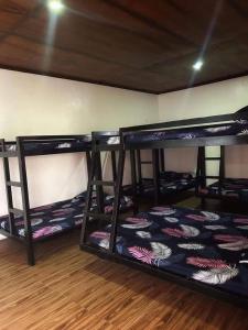 a group of bunk beds in a room at Sv hotspring resort in Calamba