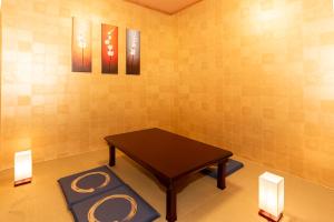 a small room with a table in the corner at Stay Kobe B in Kobe
