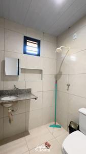a bathroom with a shower and a toilet and a sink at Casasukyara in Amontada +12 photos