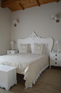 Un pat sau paturi într-o cameră la Masseria Casanova
