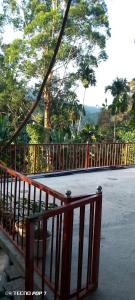 an orange fence with a view of a street at Charming View Homestay in Ella +64 photos
