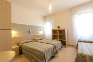 Voodi või voodid majutusasutuse Hotel Colonna toas