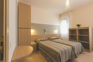Voodi või voodid majutusasutuse Hotel Colonna toas