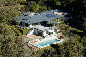 an overhead view of a house with a swimming pool at Kooyong, Kangaroo Valley in Kangaroo Valley