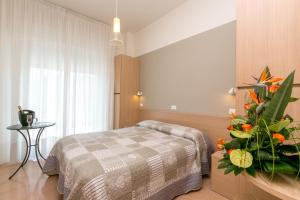 Voodi või voodid majutusasutuse Hotel Colonna toas