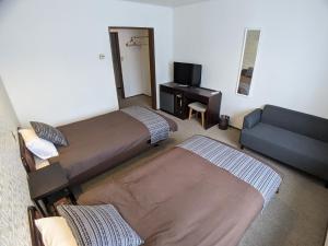 White Tree Lodge Madarao Tangram客房内的一张或多张床位