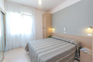 Voodi või voodid majutusasutuse Hotel Colonna toas
