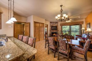 a kitchen and dining room with a table and chairs at Westgate Branson Woods Resort in Branson