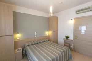 Voodi või voodid majutusasutuse Hotel Colonna toas
