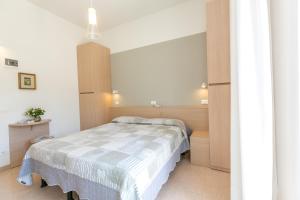 Voodi või voodid majutusasutuse Hotel Colonna toas