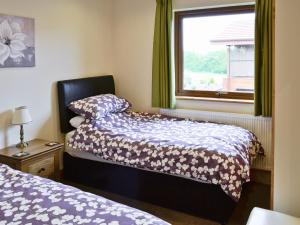 Voodi või voodid majutusasutuse Willow Lodge toas