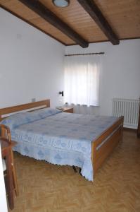 Postel nebo postele na pokoji v ubytování Albergo Vecellio