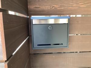 a wall with a television in a wooden wall at 京町レジダンス in Echizen +9 photos