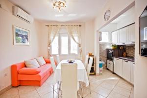 a living room with a table and a couch at Villa Stana in Vinišće +40 photos