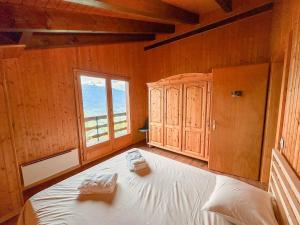 Postel nebo postele na pokoji v ubytování Chalet l'Aiglon Valais - Vue, Confort, Jacuzzi
