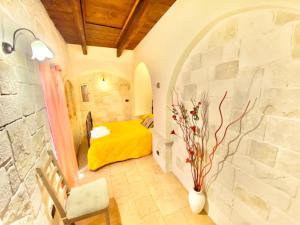 Postel nebo postele na pokoji v ubytování Trulli Bovio