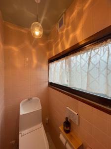 a bathroom with a toilet and a window at 蒼々さぬき志度 SOUSOU Sanuki Shido in Sanuki +22 photos