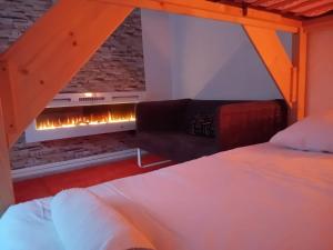 Postel nebo postele na pokoji v ubytování Les Iris