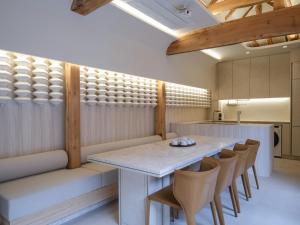 a dining room with a table and chairs at Luxury Hanok Stay Danji in Seoul