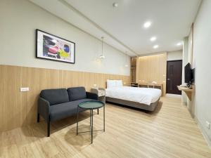 Postel nebo postele na pokoji v ubytování Yoshi Hotel - Tainan Sinmei Branch