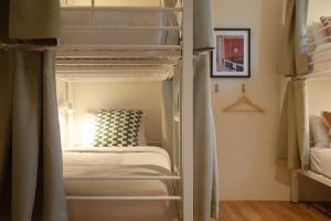 a bedroom with two bunk beds and a bed at Little Drifter Glebe in Sydney