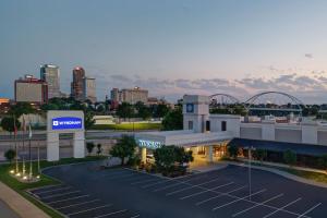 a view of a gas station with a city in the background at Wyndham Riverfront Hotel in Little Rock