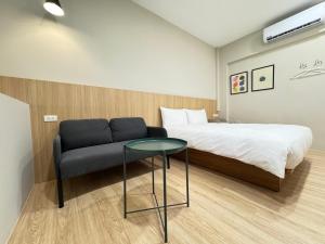 Giường trong phòng chung tại Yoshi Hotel Xinmei Street