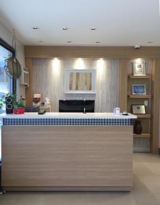 a kitchen with a blue and white counter top at Knights Inn Merritt in Merritt