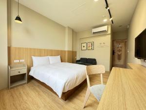 Giường trong phòng chung tại Yoshi Hotel Xinmei Street