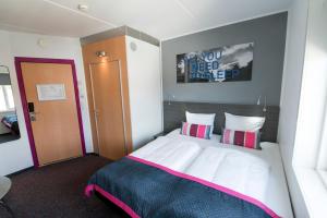 Letto o letti in una camera di Cabinn Aalborg