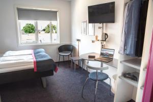 Letto o letti in una camera di Cabinn Aalborg
