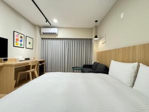 Giường trong phòng chung tại Yoshi Hotel Xinmei Street