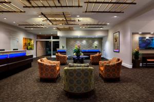 a lobby with couches and a waiting room at Desert Oasis by Vacation Club Rentals in Cathedral City