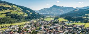an aerial view of a village in the mountains at Pöllmühle Penthouse by Alpine Host Helpers in Kirchberg in Tirol